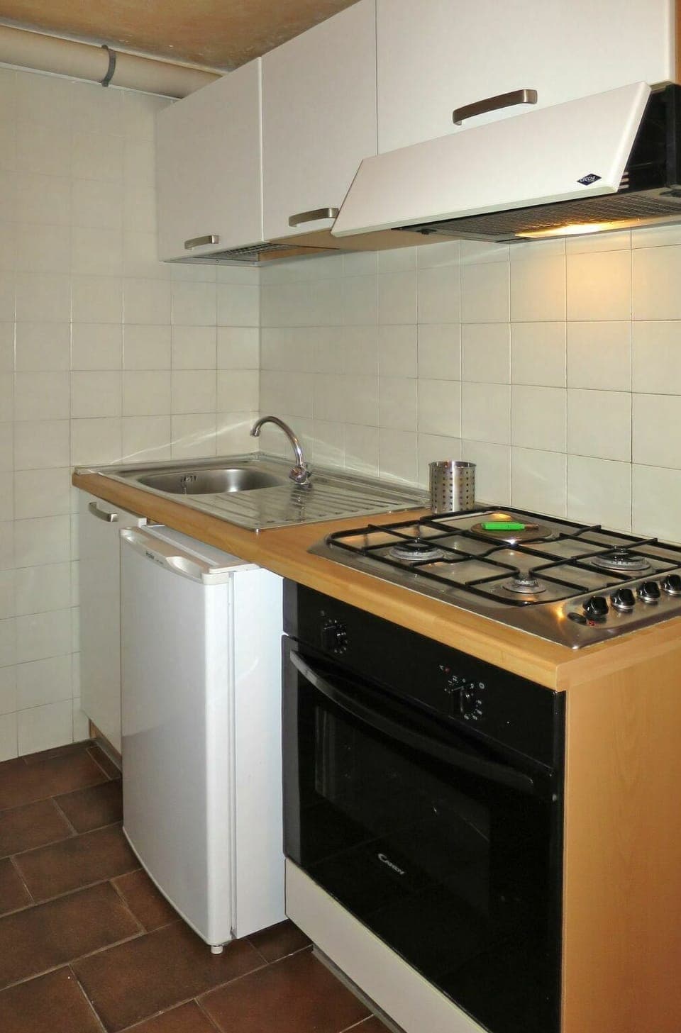 Cabinetry, Property, Countertop, Kitchen Stove, Kitchen Appliance, Building, Cooktop, Kitchen, Sink, Kitchen Sink