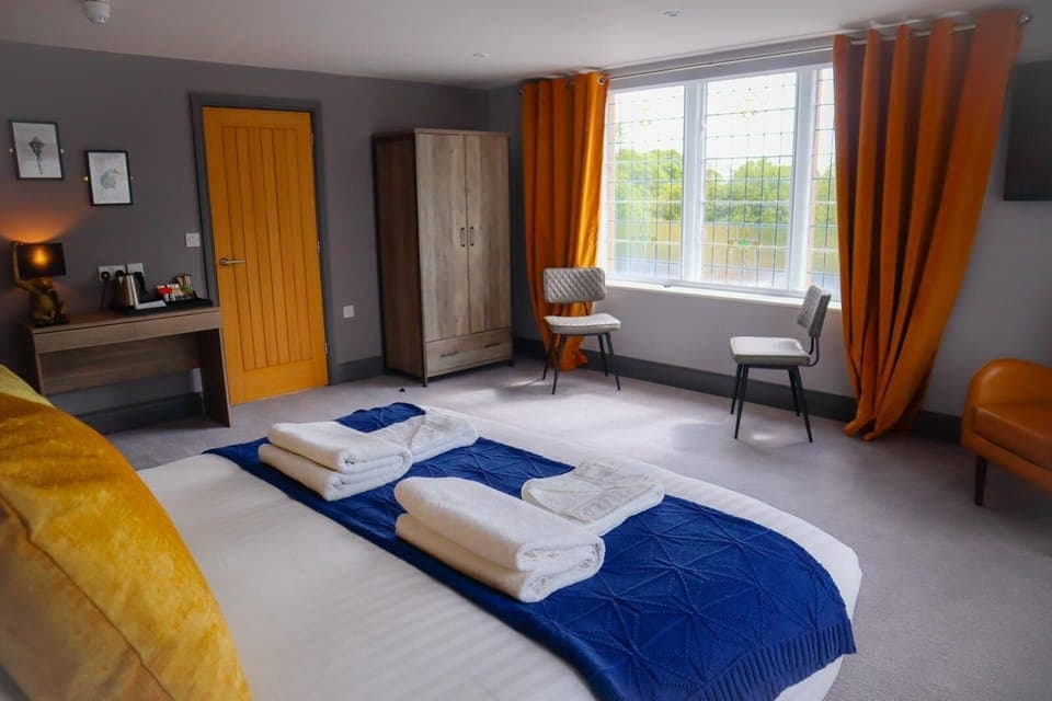 Deluxe Double Room | Desk, laptop workspace, blackout drapes, iron/ironing board