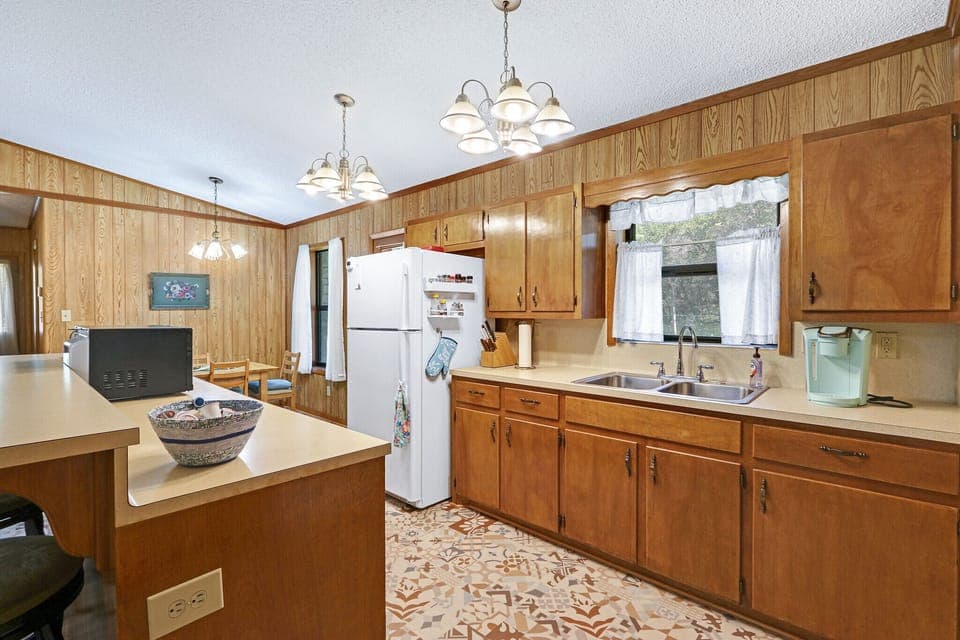 Kitchen has lots of available counter space for food preparation.