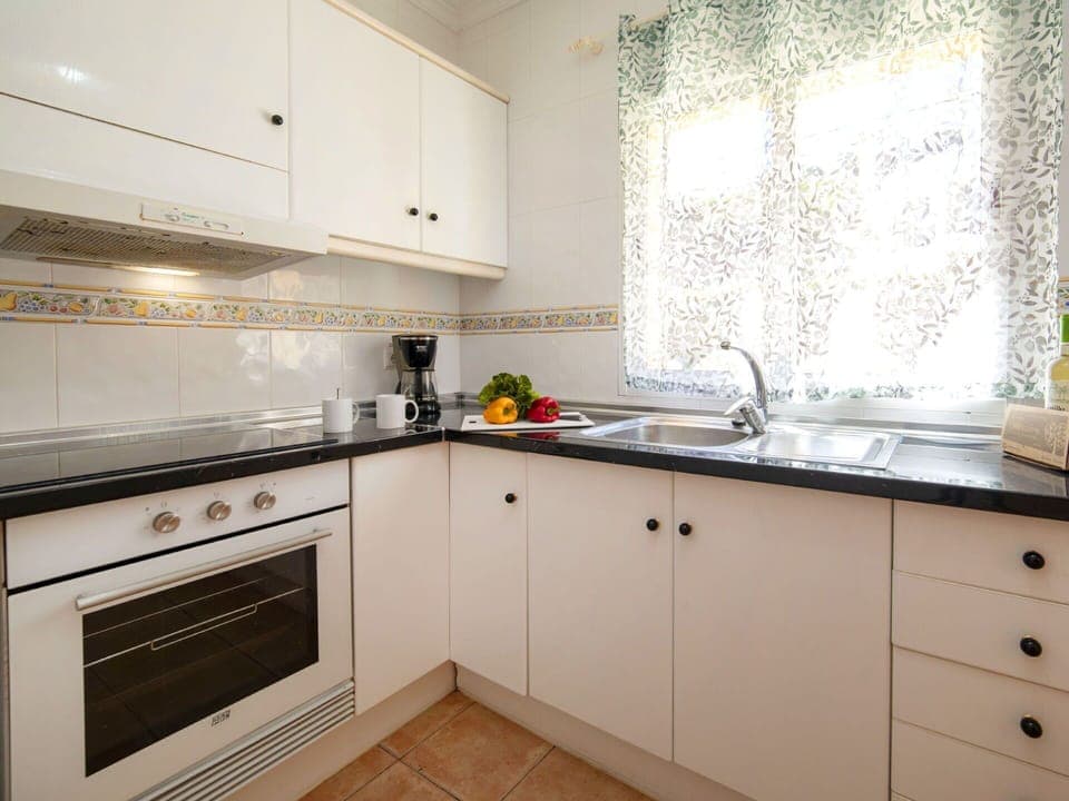 Kitchen, Kitchen Appliance, Countertop, Major Appliance, Cabinetry, Kitchen Stove, Interior Design, Stove, Flooring, Furniture