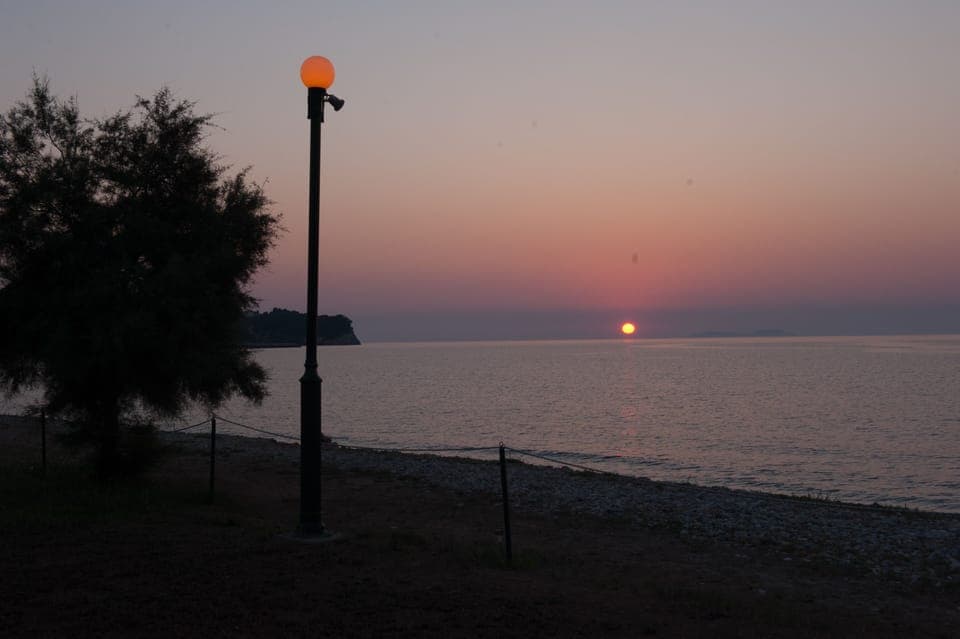 On the beach, white sand, sun loungers, beach umbrellas