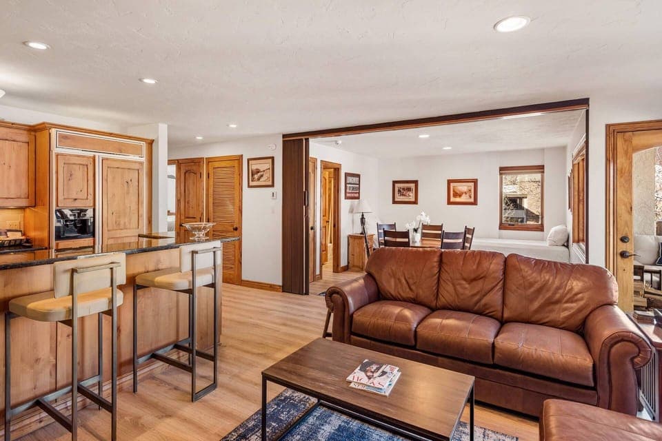 The den area doubles as dining room and an additional sleeping space with privacy provided by the accordion door when needed.