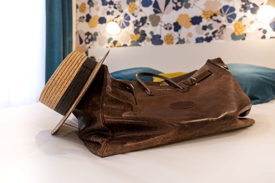 Premium bedding, desk, laptop workspace, blackout drapes