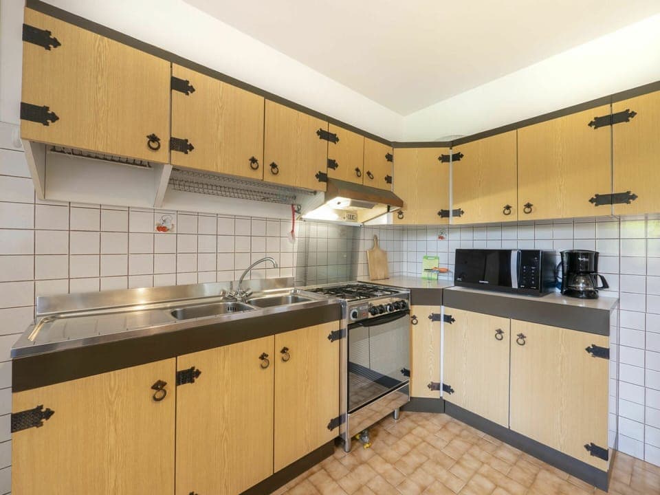 Tap, Countertop, Cabinetry, Kitchen Sink, Sink, Kitchen Appliance, Kitchen Stove, Plumbing Fixture, Kitchen, Wood