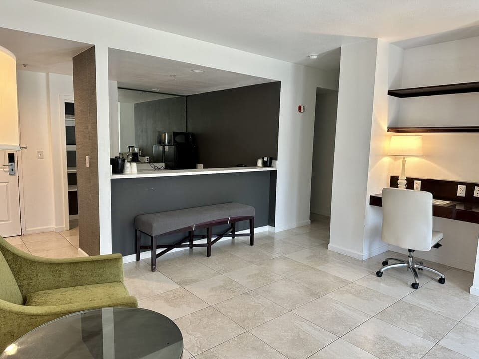 Suite, 1 King Bed, Non Smoking, Jetted Tub (Balcony) | Desk, laptop workspace, blackout drapes, iron/ironing board