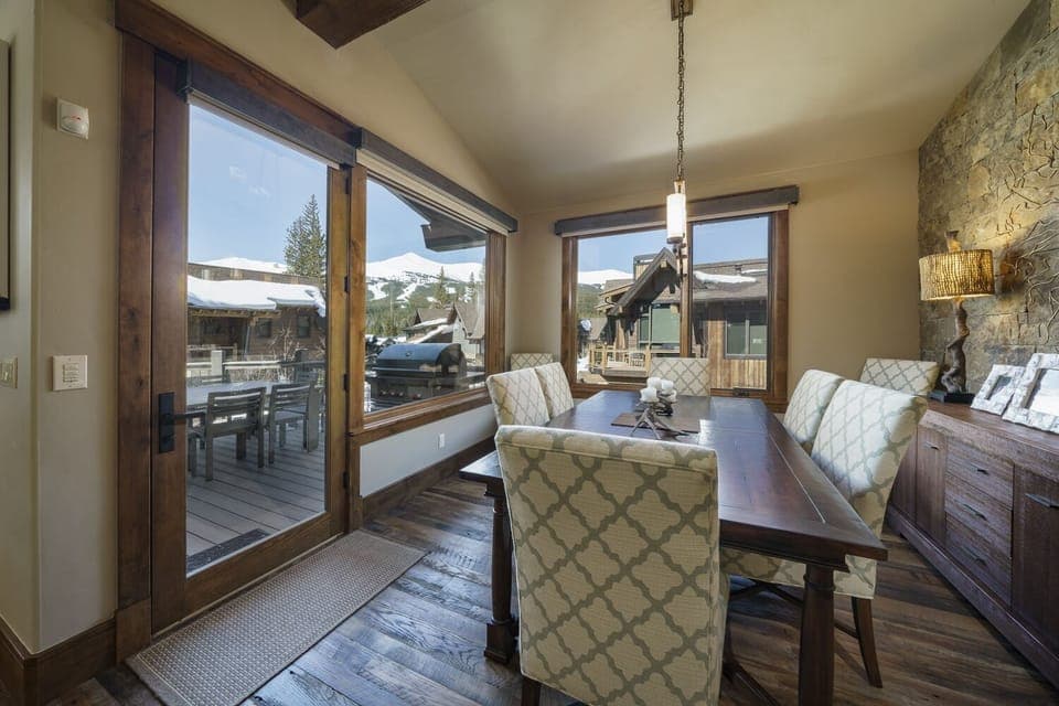 Dining room just off the kitchen in the home, and the door that leads out to the balcony.