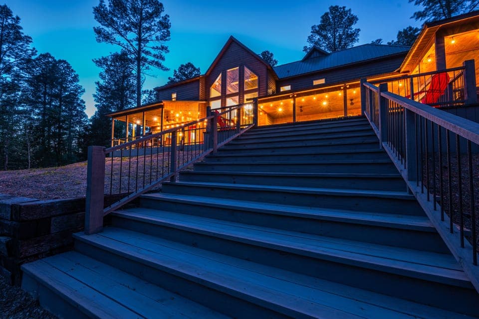 Magnolia Creek Lodge is a spacious farmhouse-style luxury cabin located in Hochatown near Broken Bow Lake.