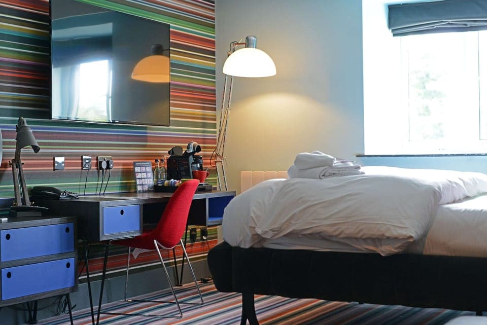 Club Room (FREE Gym & Pool Access) | Desk, laptop workspace, blackout drapes, iron/ironing board