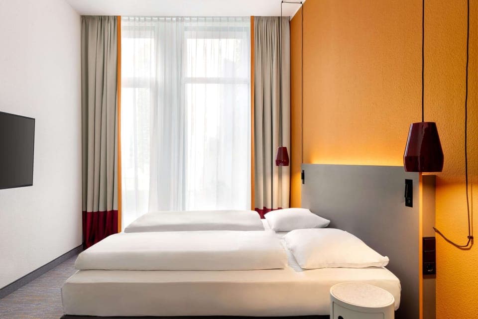 Hypo-allergenic bedding, desk, blackout drapes, soundproofing