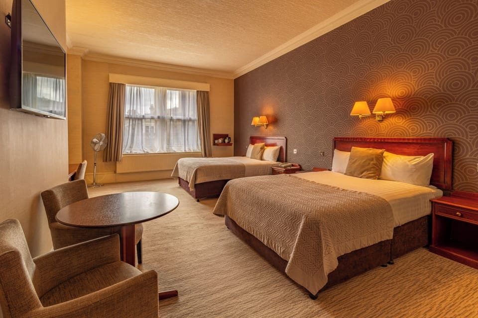 Family Room, 2 Double Beds | Hypo-allergenic bedding, desk, iron/ironing board, free WiFi