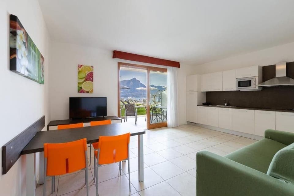 Standard Apartment | Living area | 32-inch LCD TV with satellite channels, TV