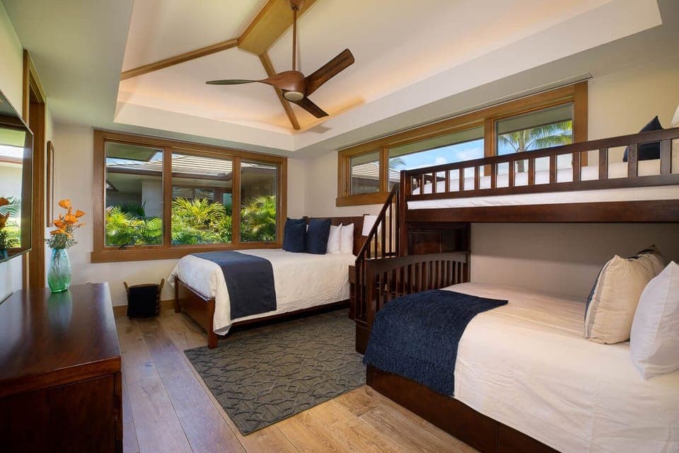 This versatile bedroom includes a queen bed and twin bunk—great for families or the kids' own space.