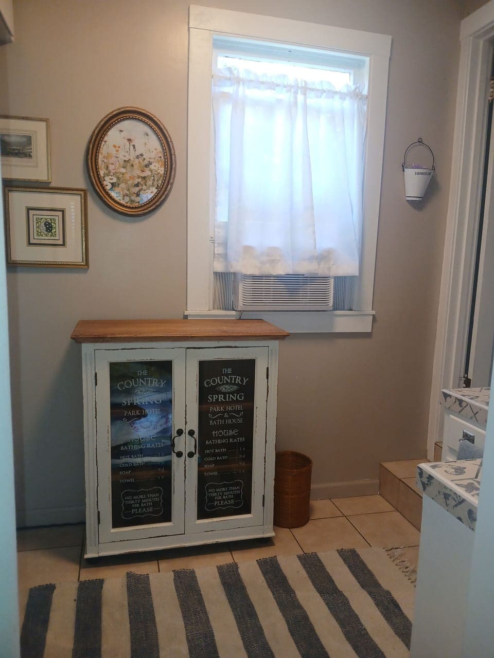 Cabinet space with beach towels and table cloths.