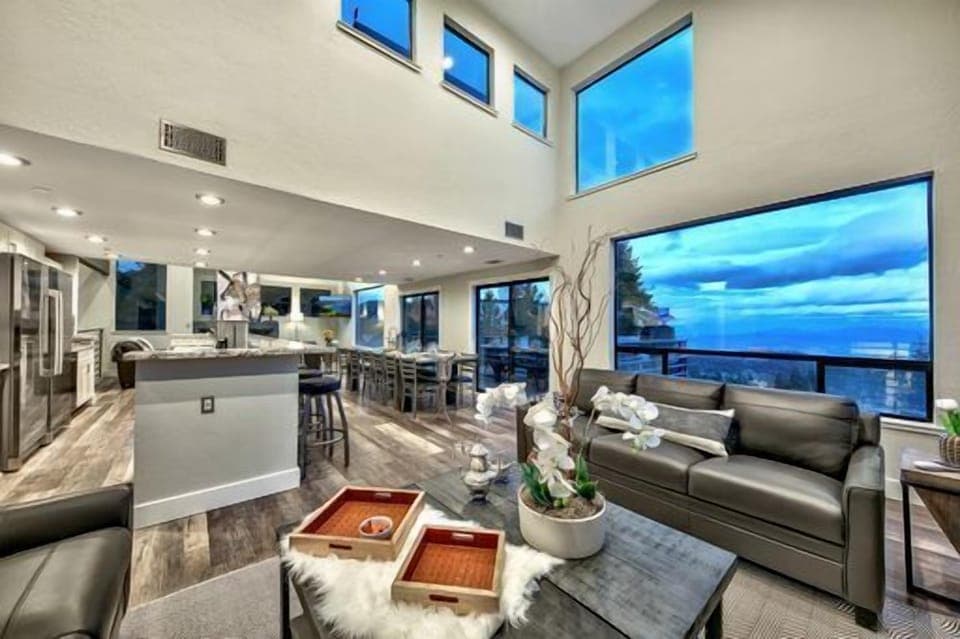 Experience the breath-taking views with the 20 foot high ceilings that capitalize on the breathtaking views of Genoa Valley and the Heavenly World class ski resort. 8 Large sectional sofas set in front of huge 60-inch Flat Screen TV, Additional seating in conversation area in the middle of the room for 12 in the Great room perfect for everyone to enjoy Food Drinks and the Family and Friends