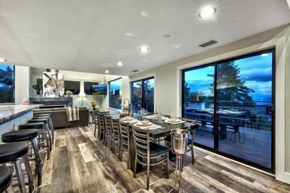 Experience the breath-taking views with the 20 foot high ceilings that capitalize on the breathtaking views of Genoa Valley and the Heavenly World class ski resort. 8 Large sectional sofas set in front of huge 60-inch Flat Screen TV, Additional seating in conversation area in the middle of the room for 12 in the Great room perfect for everyone to enjoy Food Drinks and the Family and Friends