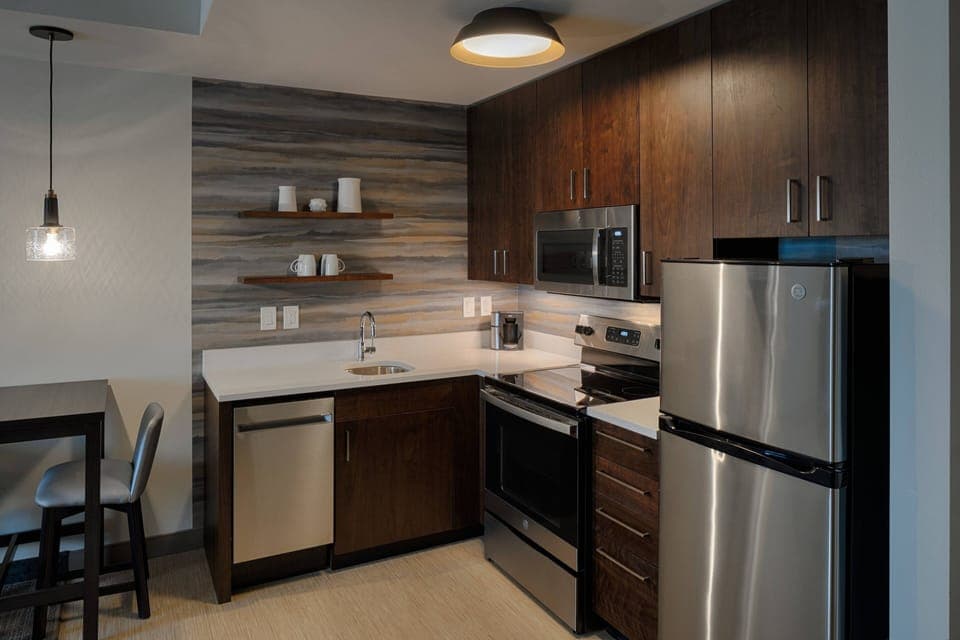 Hypo-allergenic bedding, desk, laptop workspace, blackout drapes