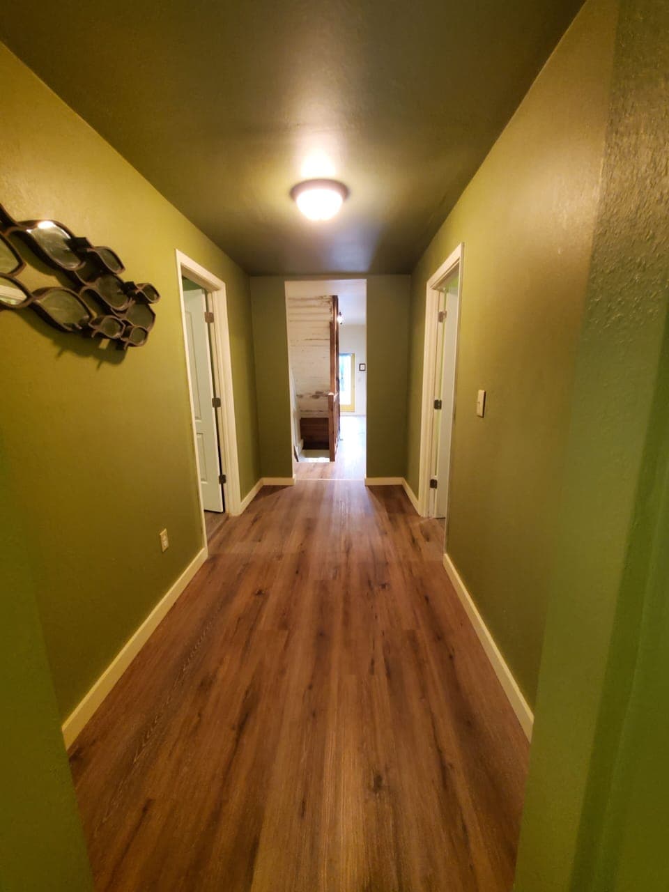2nd floor hallway, 3 bedrooms, laundry room, living room, backyard access