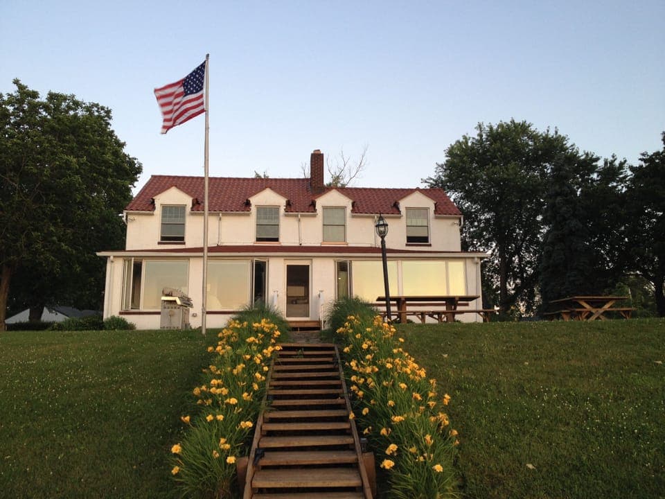 View of home from deck by lake