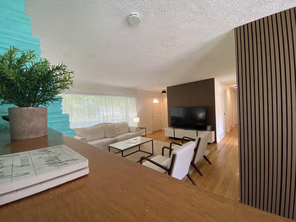 Gather around in the living room with plenty of seating to watch your favorite movies on the 65" Smart TV, work on a puzzle, or just hang out.