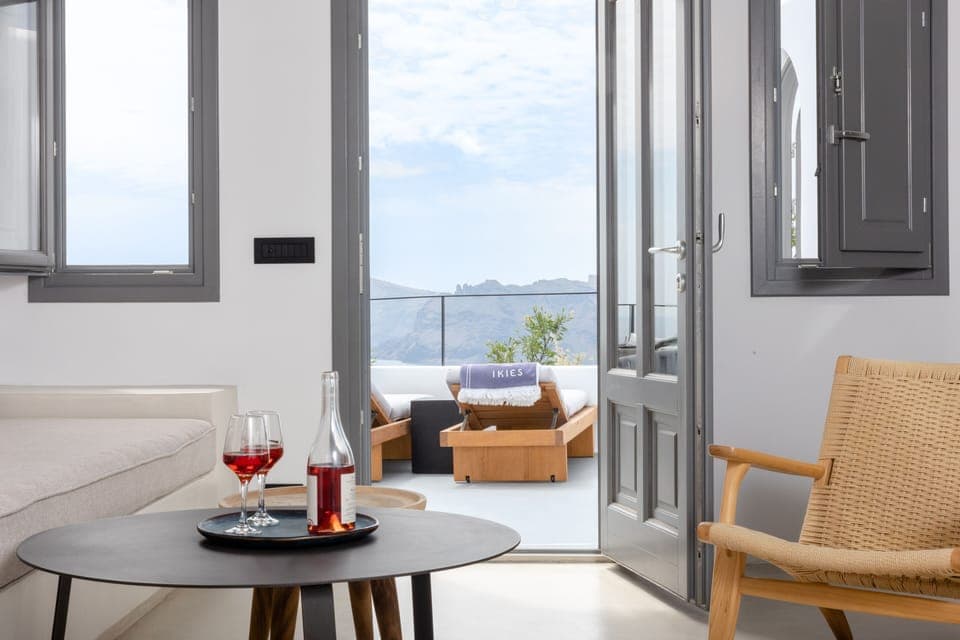 The Alchemist's Maisonette with Hot Tub & Caldera View | Living area | 50-inch flat-screen TV with satellite channels, TV