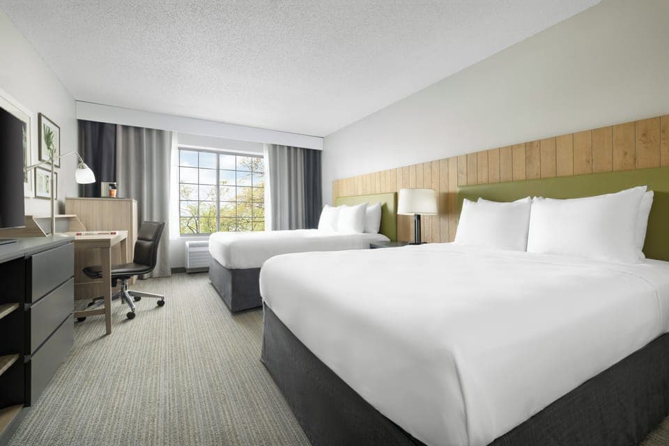 Blackout drapes, iron/ironing board, free cribs/infant beds