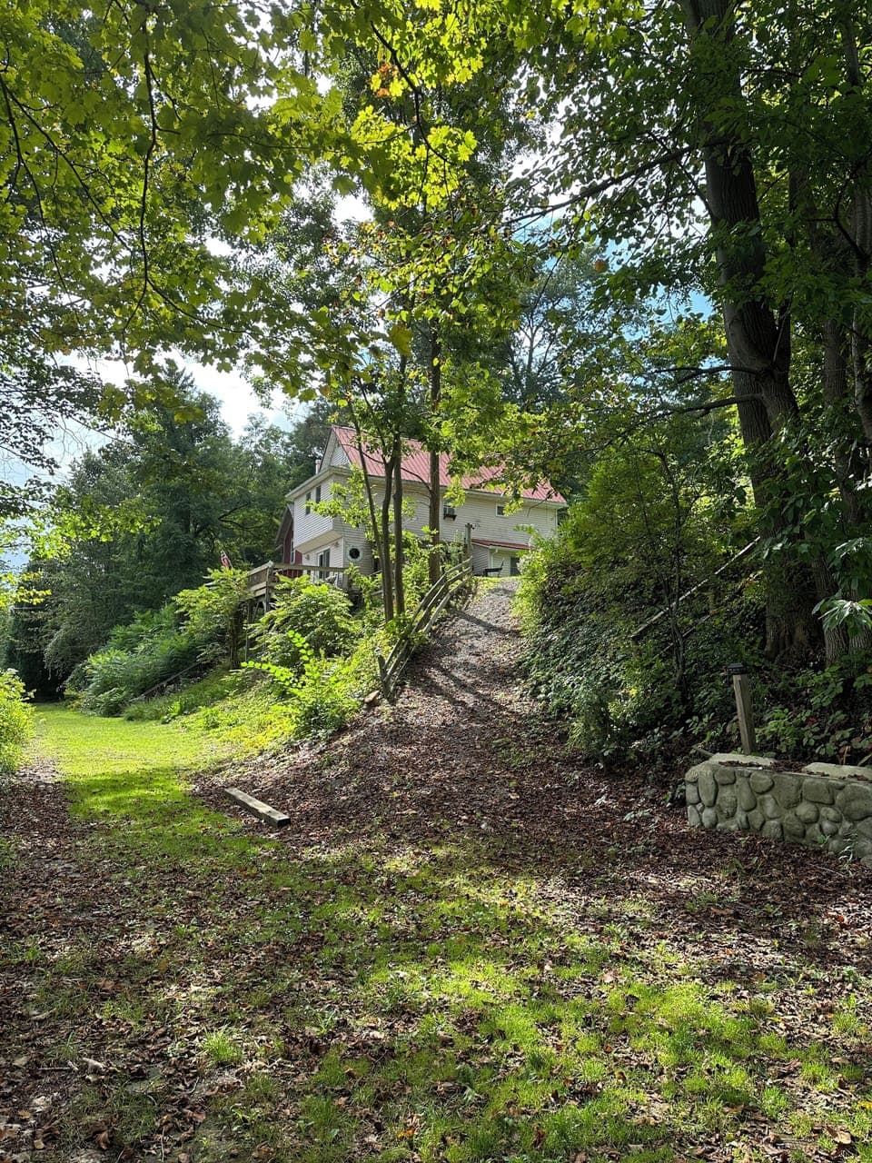 From lake access point looking up the steep hill to cottage