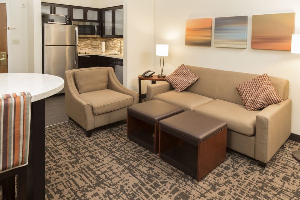 Premium bedding, desk, laptop workspace, blackout drapes
