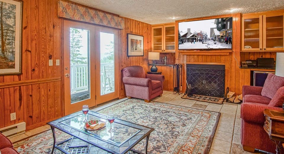 Here you can see the wood fireplace and the balcony doors in the living room.