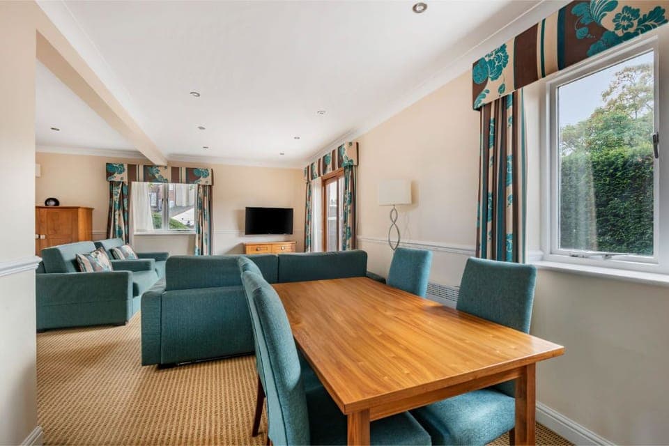 Dining area adjacent to the living space, perfect for meals and socializing.