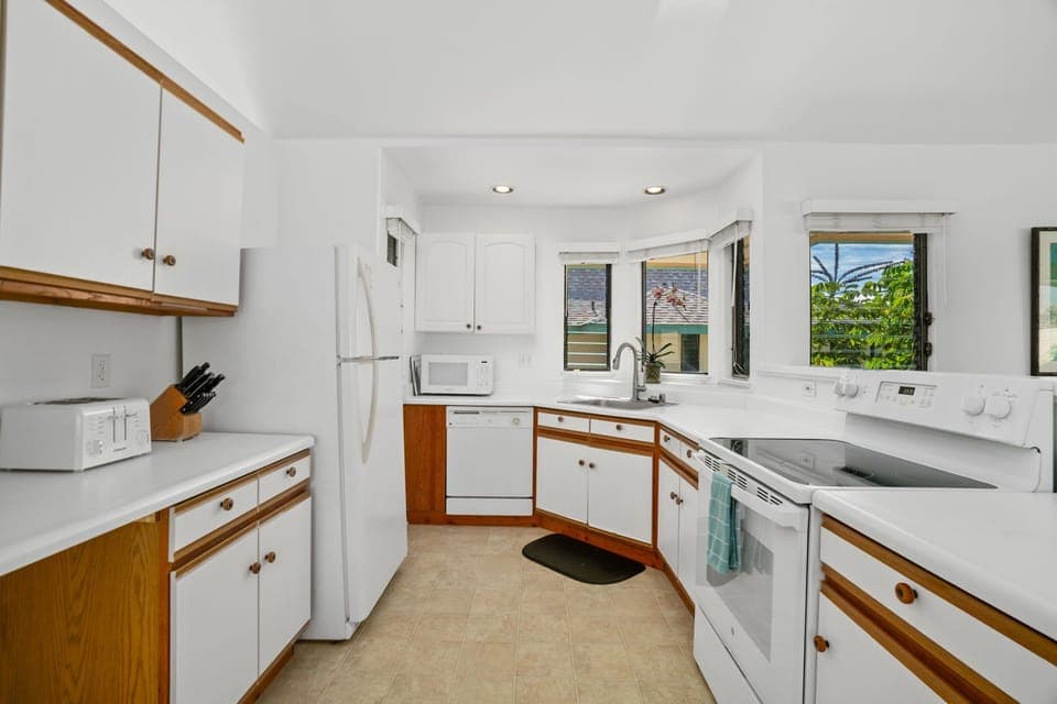 Kitchen is fully equipped with pots, pans and utensils