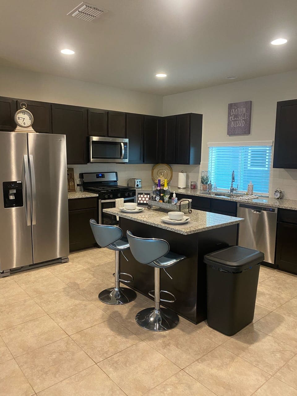 Kitchen area w Island and Lots of Counter Space w New Stainless Steel Appliance