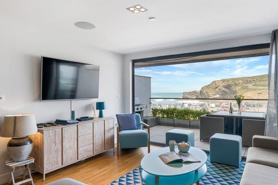 SeaEsta, Portreath. First floor: Sitting area with Smart television and bi-fold doors to large balcony