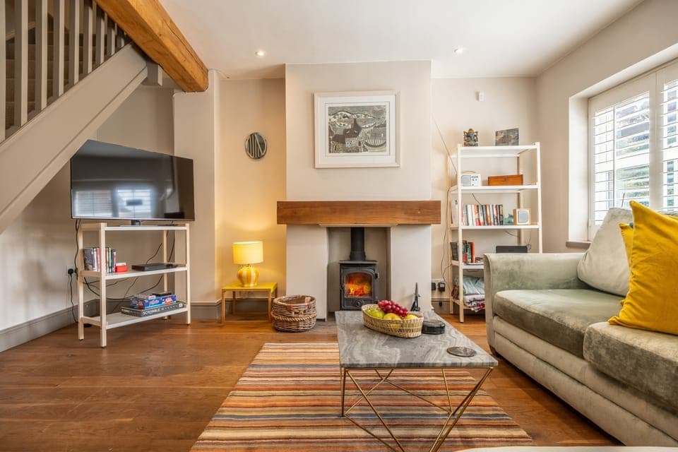 Sherbet Cottage, South Creake: A cosy sitting room warmed by a wood burning stove