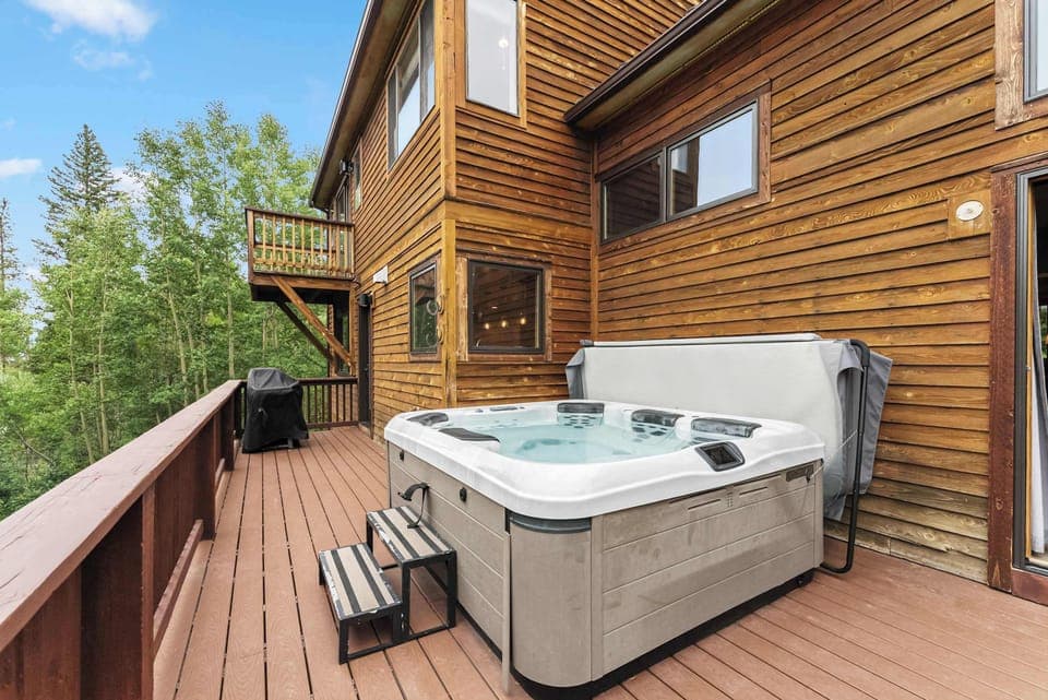 Hot tub: Private 6-person hot tub with panoramic mountain views