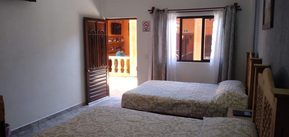 Basic Quadruple Room, 2 Queen Beds | Laptop workspace, free WiFi, bed sheets