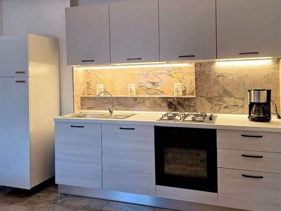 Tap, Cabinetry, Countertop, Property, Sink, Plumbing Fixture, Kitchen, Wood, Kitchen Stove, Kitchen Sink