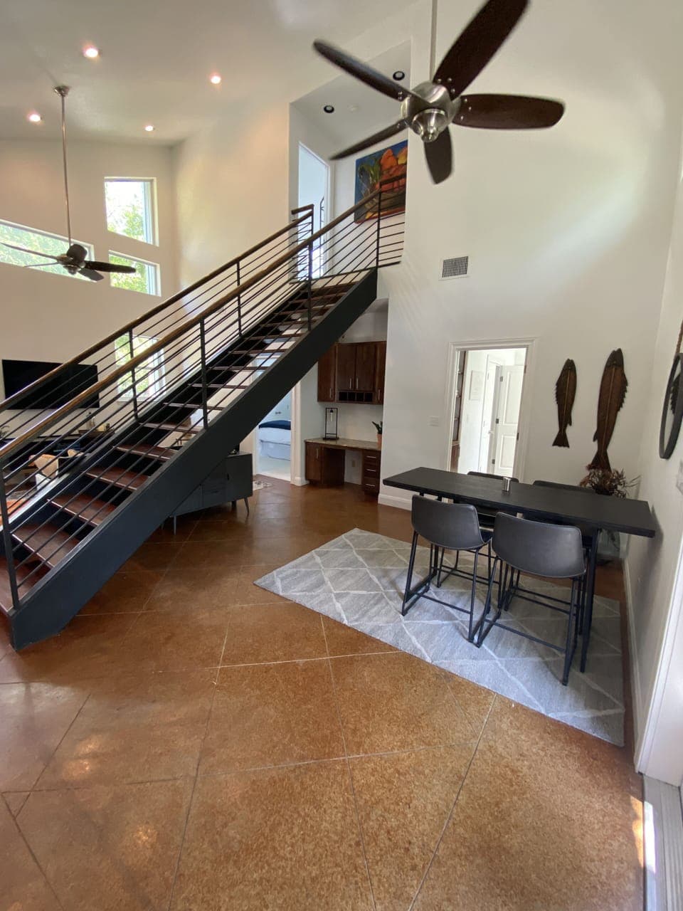 The central staircase perfectly connects the open-floor plan to the 2nd floor.