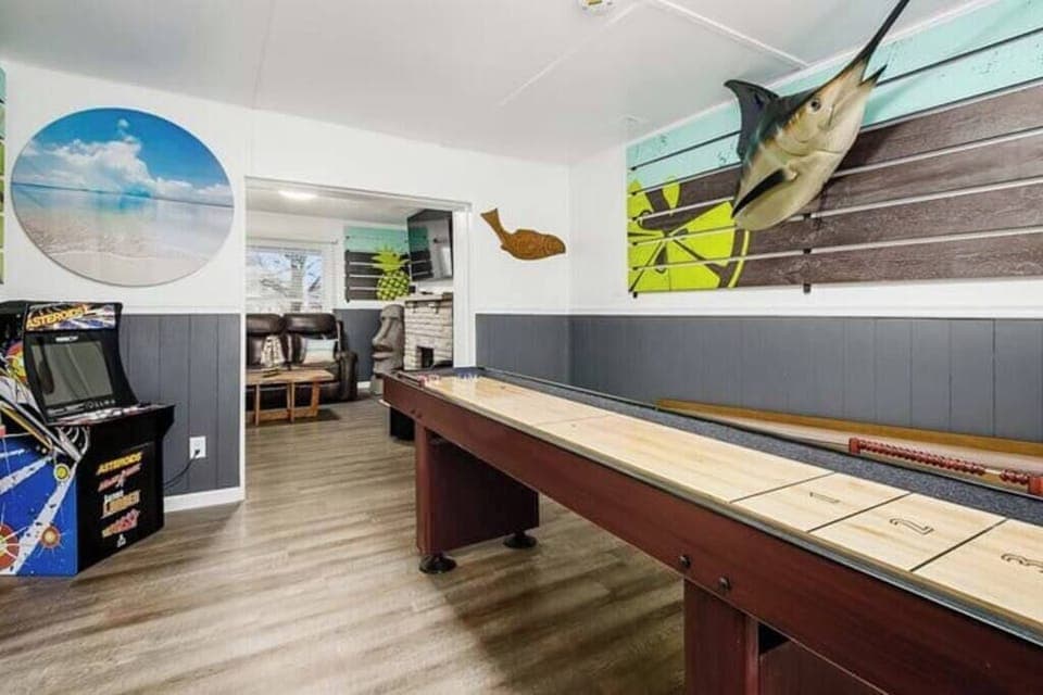 First floor gaming room includes Skeeball, shuffleboard, arcade games and board games.