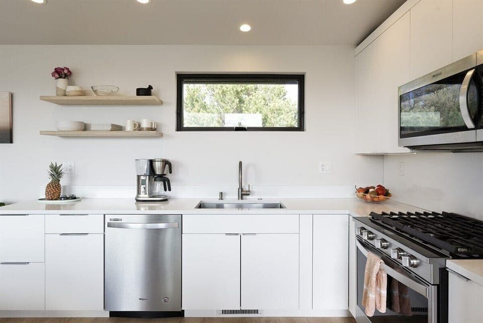 Open-concept kitchen, dining, and living room.