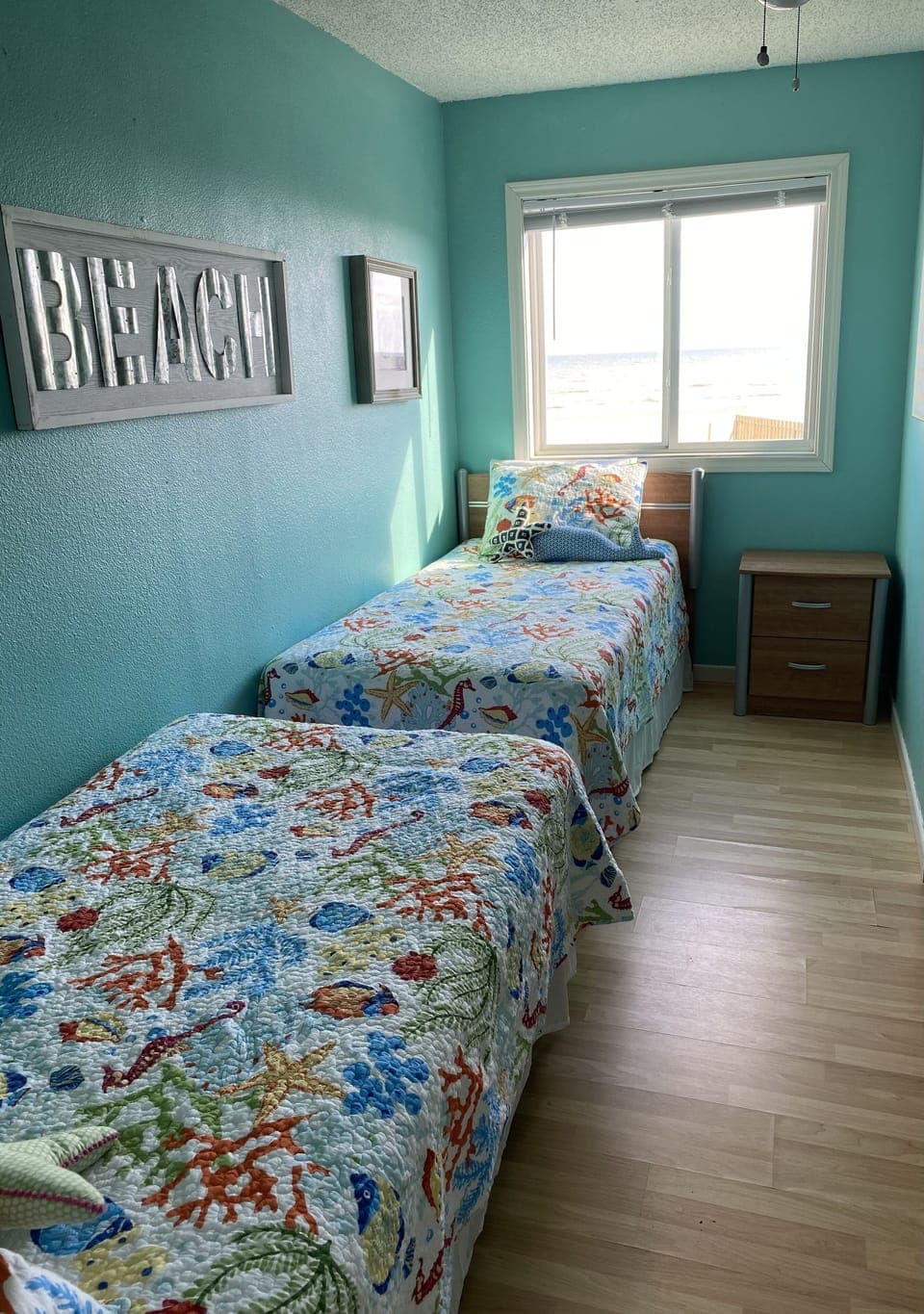 EAT SLEEP BEACH bedroom with two twin beds.  Great for kids.