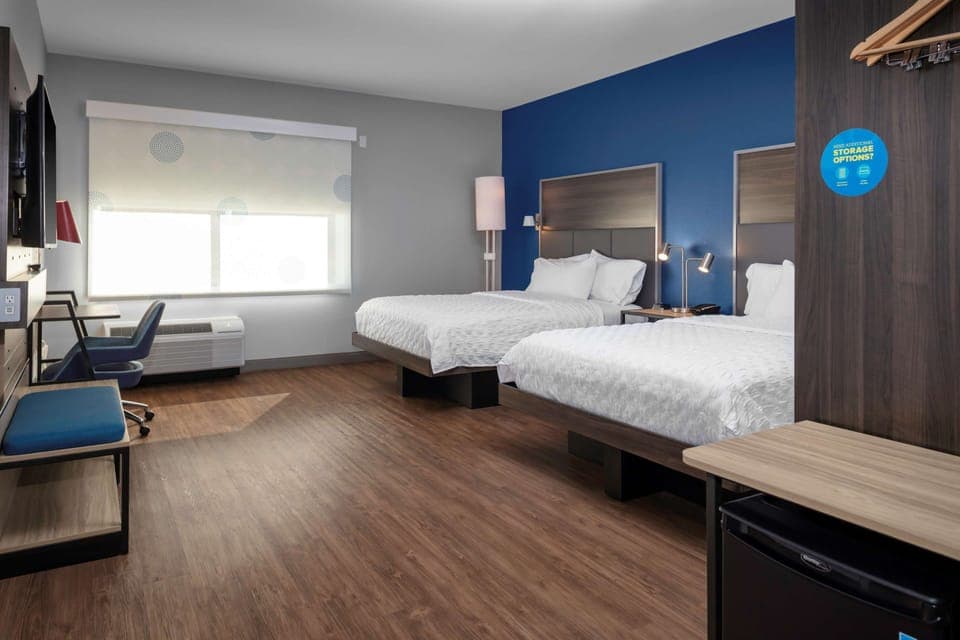 Premium bedding, Tempur-Pedic beds, desk, laptop workspace