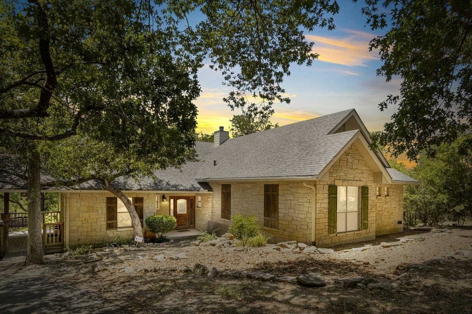 The landscaping and construction of the Guadalupe River Retreat make it look right at home in its riverside setting.