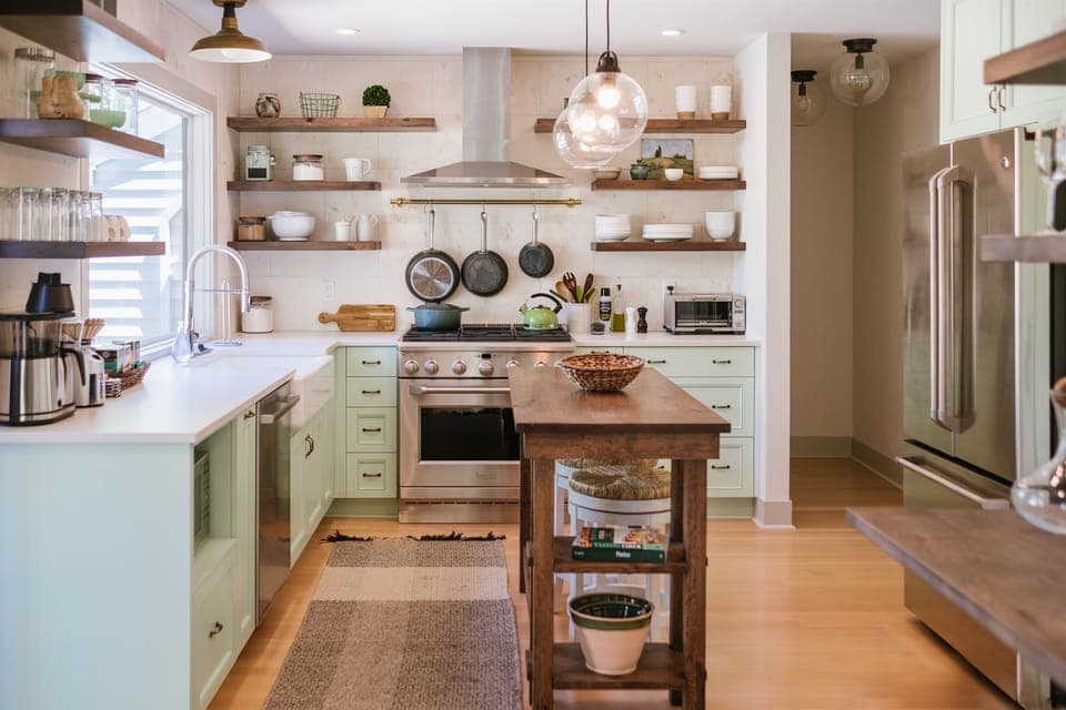 Custom kitchen with GE Monogram 6 burner gas stove, fridge with filtered water, drip coffee machine & grinder with local coffee, and tea kettle with a selection of loose-leaf teas.