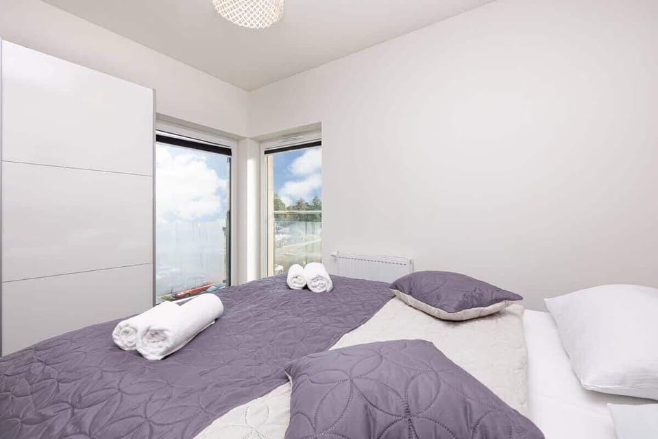 Bedroom of Pięć Mórz Lotnicza 1I/20 apartment with double bed