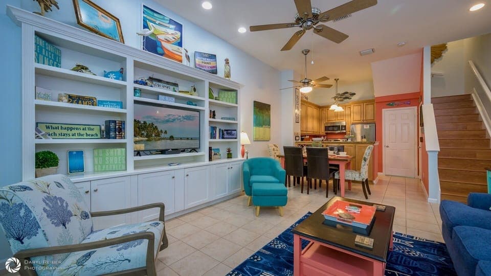 The first floor of the townhome features the living room, dining area, and kitchen...