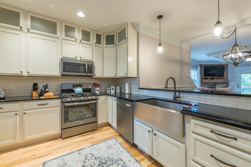 Fully equipped kitchen with gas range, dishwasher, and walk-in pantry.