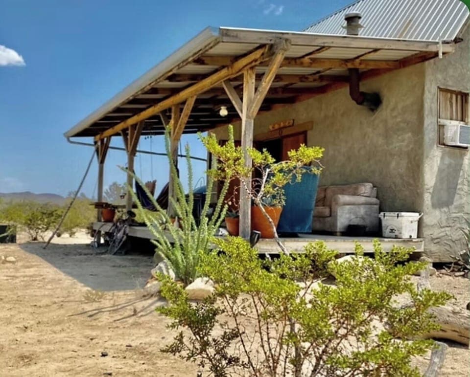 Casa de Creosote on a vibrant sunny day. Front porch protection.