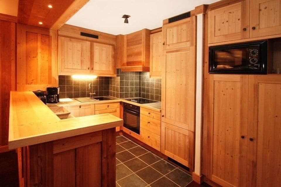 Prepare a meal in the equipped kitchen.