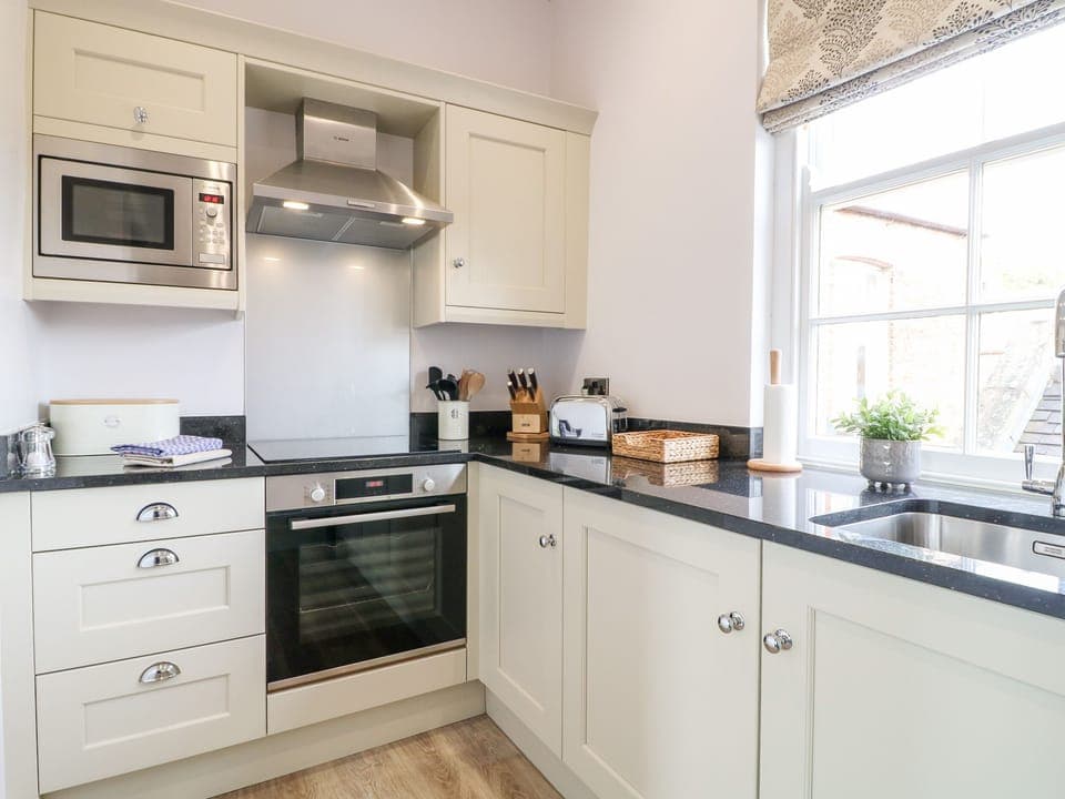 Fridge, electric kettle, toaster, cookware/dishes/utensils