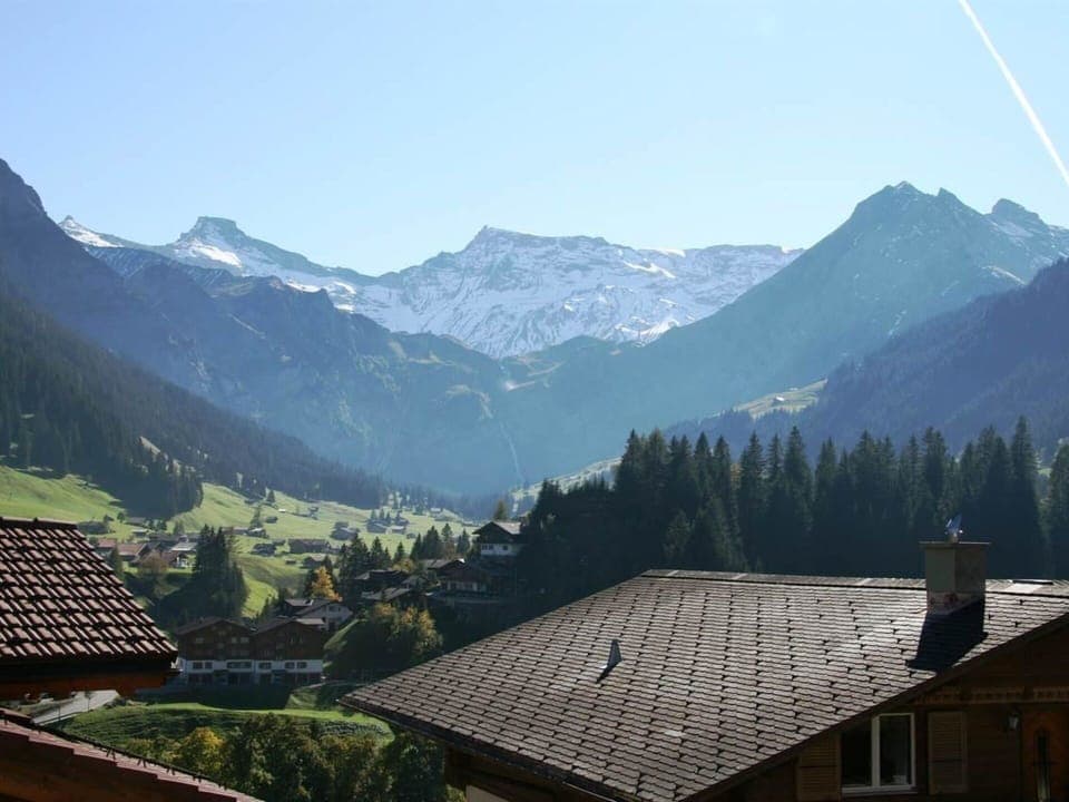 Sky, Mountain, Daytime, Building, Nature, Highland, Tree, Atmospheric Phenomenon, House, Biome